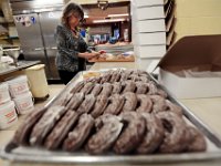 1008020024 ma nb MasDonuts  Sheila Lemieux prepares a tray of coffee rolls at Ma's Donuts on Acushnet Avenue in the north end of New Bedford.   PETER PEREIRA : food, restaurant, eat, morning, breakfast, work, labor